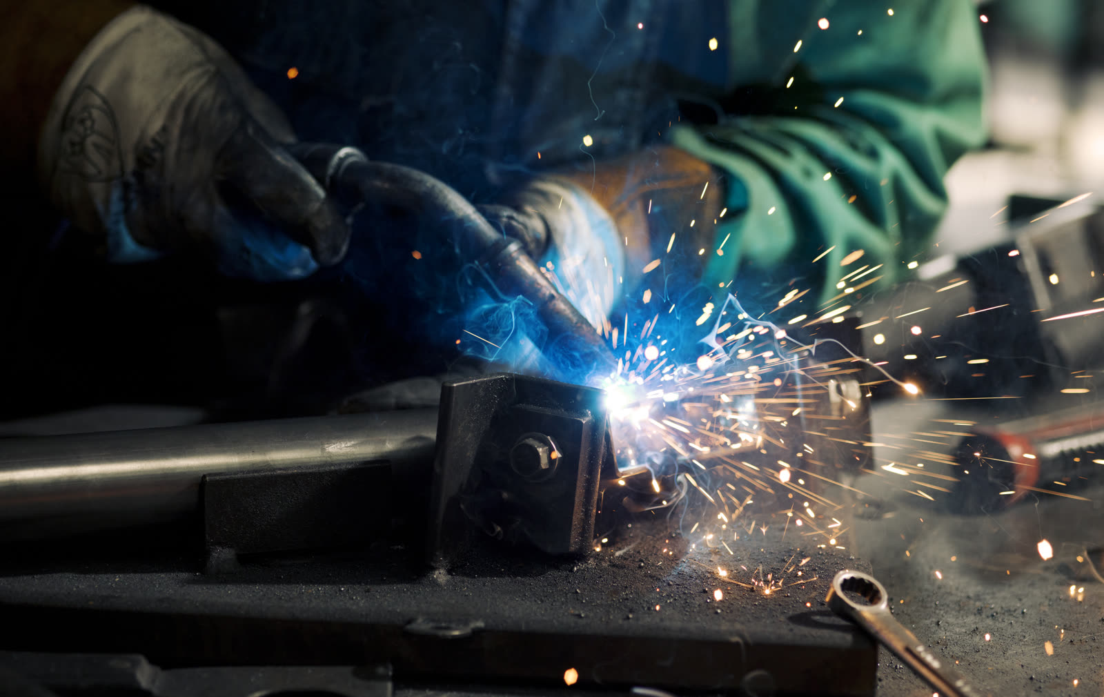 Close up of welding sparks joining an adaptive bike frame